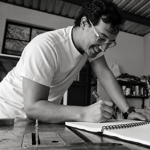 Francisco sketching a design in the workshop