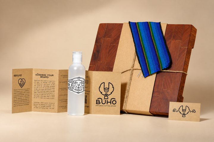 The full Búho GT system: a wrapped board, care oil, manual, and business card styled together