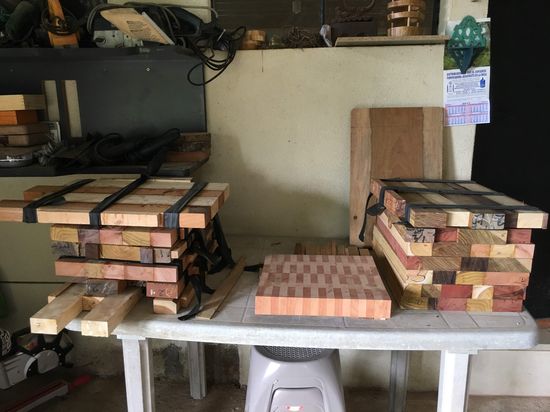 Raw hardwood stock stacked before being cut into butcher blocks